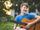 Young person playing guitar in the garden
