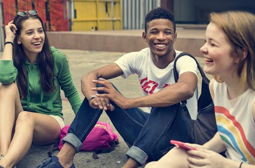 Group of young people laughing and talking