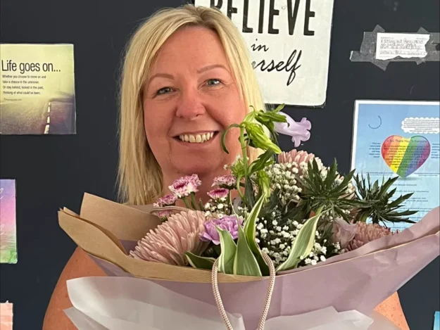 Hayley receives flowers for her 20 year work anniversary at Dove