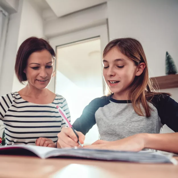 Support worker helping young person with homework
